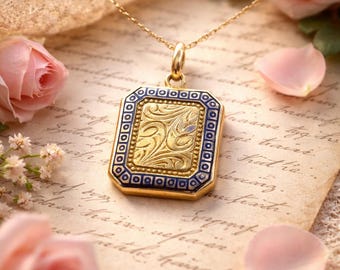 Locket with engraved scrollwork and blue enamel in 14 karat yellow gold