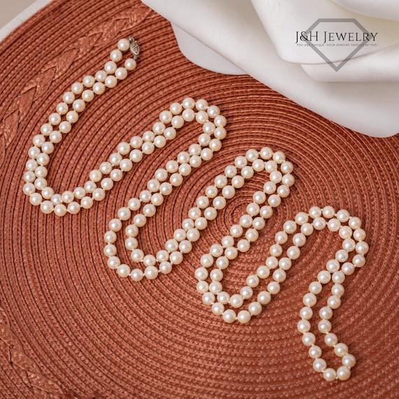 62" 7mm Cultured Pearls Necklace with 14 karat yel