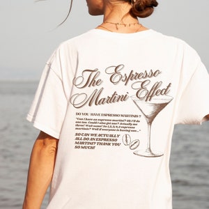 espresso martini oversized t-shirt, espresso martini graphic tee, vintage alcohol tee, vintage cocktail tee, brown retro espresso martini logo on white t-shirt, espresso martini women's tee