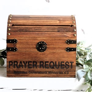 May include: Wooden prayer request box with a slot on the top and the words "Prayer Request" and "Anointed Generations Ministries 4:3" engraved on the front.