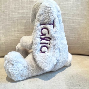 Monogrammed stuffed bunny with name on the ear. Grey bunny shown with purple monogram