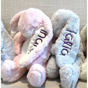 Monogrammed stuffed bunny with name on the ear. Pink and grey bunnies shown