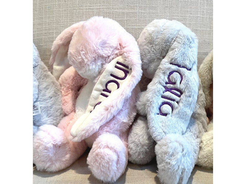 Monogrammed stuffed bunny with name on the ear. Pink and grey bunnies shown