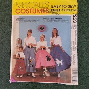May include: A vintage sewing pattern for a 50s style skirt. The pattern is for misses sizes 4-18 and girls sizes 3-14. The pattern cover features a group of girls wearing the skirts in a diner setting. The pattern is titled "McCall's Easy to Sew Costumes."