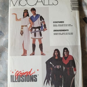 May include: A McCall's sewing pattern for costumes. The pattern includes instructions for making a Cleopatra costume, a Roman soldier costume, a vampire costume, and a skeleton costume. The pattern is titled "Grand Illusions".