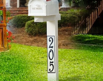 May include: White mailbox with a black "US Mail" sign and a black and white house number sign with the number 205 on a white post.