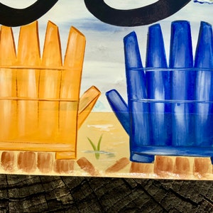 May include: A painted wooden sign with two beach chairs, one yellow and one blue, on a sandy beach background.