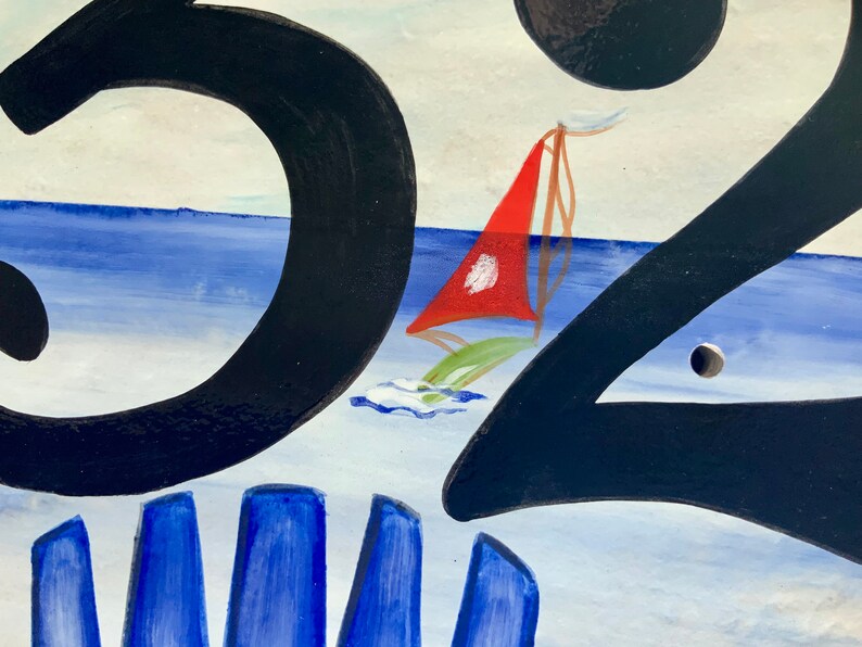 May include: A hand-painted house number sign with the number "32" in black paint. The background is a blue and white seascape with a red sailboat.