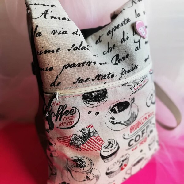 Mochila de tela, mochila dos aperturas, mochila gran capacidad, mochila tela cafés, mochila tela letras, mochila correas regulables