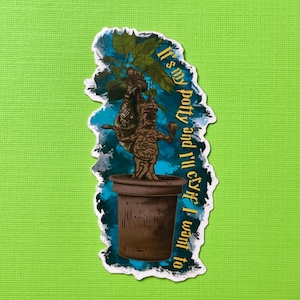 Könnte beinhalten: Ein Aufkleber mit einer Cartoon-Illustration einer Topfpflanze Mandragora mit einem blauen und grünen Aquarellhintergrund. Der Text auf dem Aufkleber lautet "Es ist mein Töpfchen und ich werde weinen, wenn ich will".