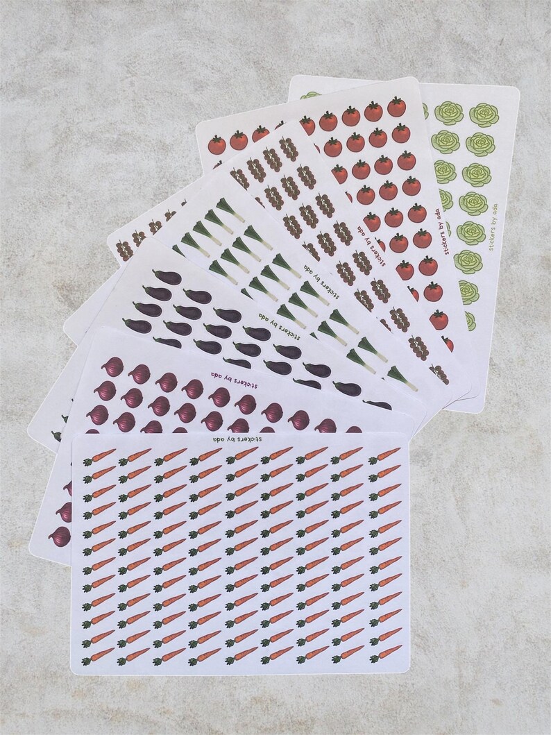 May include: A collection of seven rectangular sticker sheets featuring various vegetable illustrations including carrots, red onions, eggplants, green onions, skewers, tomatoes, and lettuce. Each sheet displays the text stickers by ada.