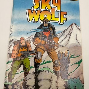 May include: A comic book titled Sky Wolf, number 1 of 3, featuring three armed characters in a mountainous landscape. The cover displays the Eclipse Comics logo, the text Air Fighters, and a price of $1.75. The characters wear tactical gear.