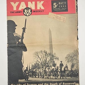 May include: A vintage May 11, 1945 issue of Yank, The Army Weekly magazine. The cover features a black and white photograph of a military procession with the Washington Monument in the background, a soldier with a rifle, and the text The Life of Truman and the Death of Roosevelt.