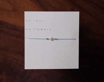 Dahlia - Flower Friendship Bracelet on pale blue silk