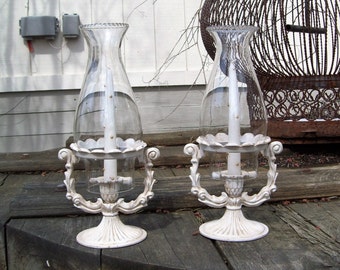 Vintage Cast Iron Candlestick Holders with Oil lamp Chimneys and candles Spiller Batavia, N.Y. Pair of 2