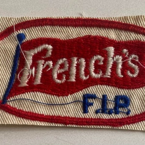 Vintage French's Brand oanvänd och oklippt tygmärke