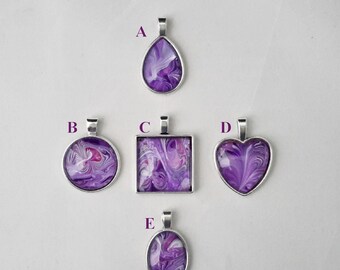 May include: Five purple and white abstract pendant necklaces with silver settings. The pendants are in the shapes of a teardrop, circle, square, heart, and oval.