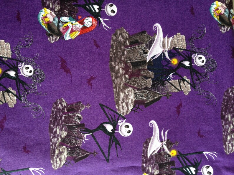 May include: Purple fabric with a repeating pattern of Jack Skellington and Sally from the Nightmare Before Christmas. The characters are depicted in a spooky Halloween setting with a graveyard and a haunted house.