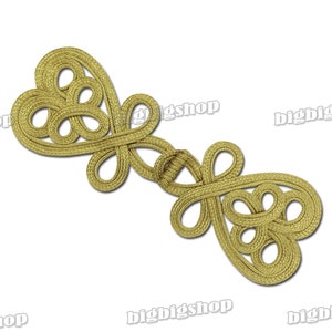 May include: A pair of gold-colored Chinese knot clasps, also known as frog closures, are made of braided cord and feature a traditional knot design. The clasps are connected by a small knot in the center.