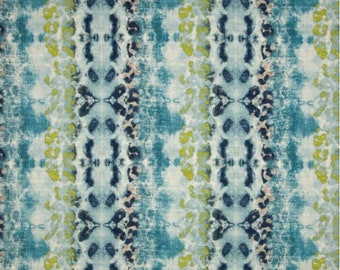May include: Abstract fabric with a blue, green, and white color scheme. The fabric has a textured, tie-dye look with a repeating pattern.