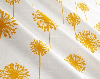 May include: White fabric with a yellow dandelion pattern. The fabric has a subtle texture and the dandelions are stylized.