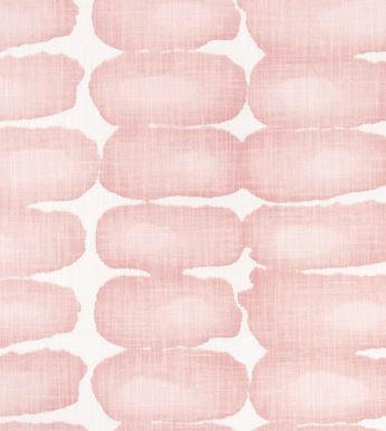 May include: A repeating pattern of soft pink, oblong shapes on a white background. The shapes have a textured, watercolor-like appearance, creating a subtle, artistic design. The fabric has a linen-like texture.