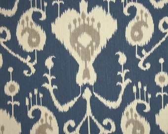 May include: A blue fabric with a white and gray ikat pattern. The fabric has a subtle sheen and a soft texture.