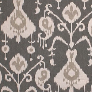 May include: Gray and white fabric with an ikat pattern. The pattern features a repeating design of stylized flowers and leaves.