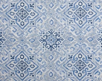 May include: Blue and white patterned fabric with a repeating geometric design. The fabric has a subtle texture and a soft, faded look.
