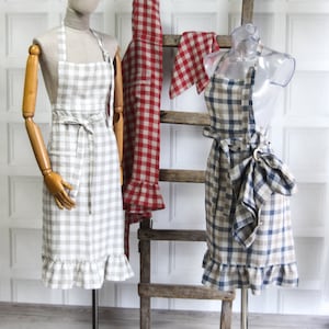 Linen apron with ruffled hem and lace details with kitchen towel, blue linen kitchen dress with frills, vintage bakery cafe red checks apron