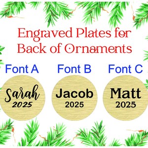 May include: Image of engraved plates for the back of ornaments. The text reads "Engraved Plates for Back of Ornaments." Three circular plates are shown with names and the year 2025 in different fonts. Green pine branches frame the image.