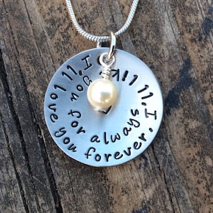 May include: Silver necklace with a round pendant that reads "I love you for always. I got you 11, 11, 11". A small pearl charm hangs from the pendant.