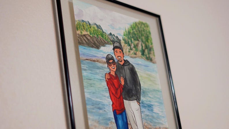 May include: A watercolor painting of a couple standing in front of a body of water. The man is wearing a black jacket and a baseball cap. The woman is wearing a red sweater and sunglasses. The background is a watercolor painting of a forest and a river.