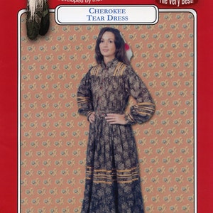 May include: A sewing pattern for a Cherokee Tear Dress. The pattern is from Missouri River Brand, developed by master craftworkers. The pattern includes a photo of a woman wearing the dress. The pattern number is 4799-500-016.