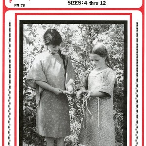 May include: Two girls wearing patterned dresses stand in a wooded area. The girl on the left is holding a long, thin piece of material. The girl on the right is holding a similar piece of material in her hands. The image is from a vintage sewing pattern for a girl's cloth Indian dress pattern. The pattern is for sizes 4 through 12.