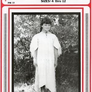 May include: A black and white photo of a young girl wearing a white dress with fringe. The dress is a pattern for a leather Indian dress. The pattern is for sizes 4 through 12. The photo is on a red and white background with a black border.