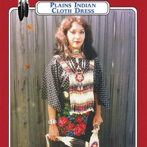 May include: A woman wearing a black and white polka dot dress with red and blue floral embroidery. She is wearing a beaded necklace and a beaded belt. The dress is a Plains Indian Cloth Dress. The image is from Missouri River Patterns.