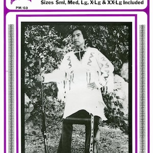 May include: Black and white photo of a person wearing a white Native American war shirt with fringe and beading. The person is holding a rifle and is standing in a wooded area. The image is from a sewing pattern for a Native American war shirt. The text on the image reads "INDIAN WAR SHIRT PATTERN Sizes Sml, Med, Lg, XLg & XX-Lg Included"