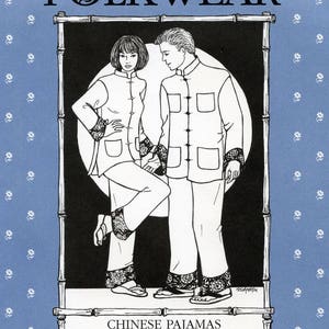 May include: Illustration of two people wearing white Chinese pajamas with black and white patterned cuffs and trim. The image is framed by a bamboo-style border and set against a blue background with floral accents. The text "FOLKWEAR" and "CHINESE PAJAMAS" are displayed.