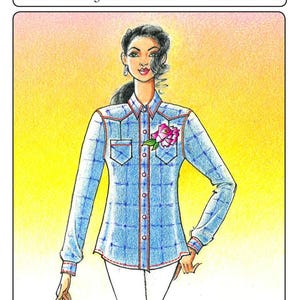 May include: A blue and white plaid shirt with a red trim and a pink flower pin. The shirt has a button-down front and long sleeves. The text "WAIMEA RANCH SHIRT" and "From Victoria Jones Collection" is at the top of the image. The text "110 Misses Small - 2X" is at the top right of the image.
