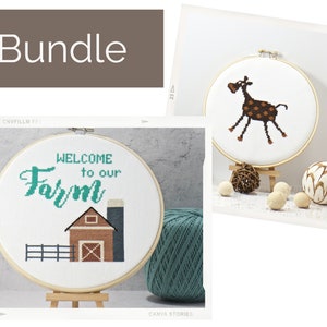 May include: A bundle of two embroidery hoop kits featuring a brown and white giraffe and a white farmhouse scene with the text "Welcome to our Farm".