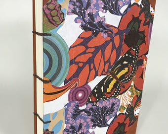 Handmade Coptic Journal: Exposed sewing and fabric hard covers.