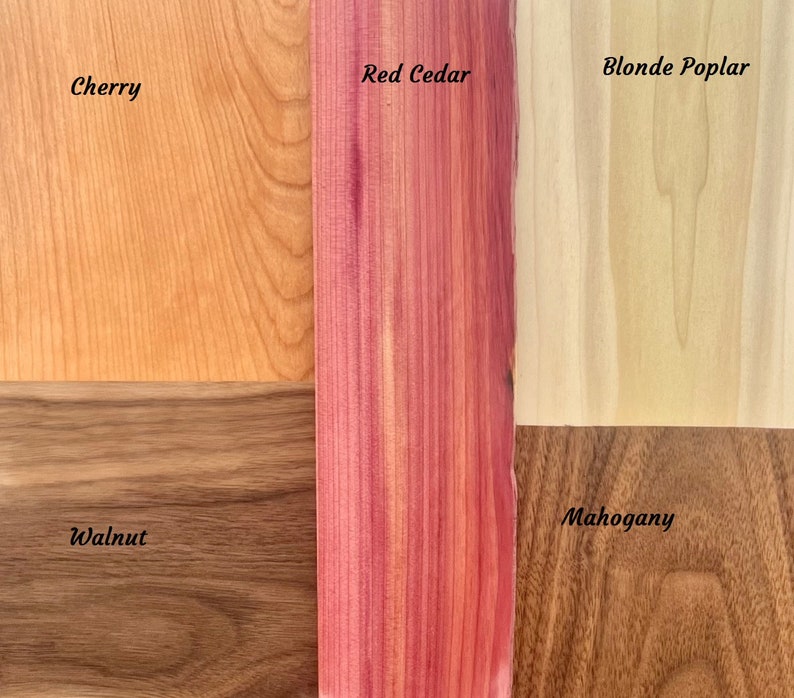 May include: Close-up of six wood samples, each labeled with its name: Cherry, Red Cedar, Blonde Poplar, Walnut, Mahogany. The wood samples are arranged in a grid pattern.