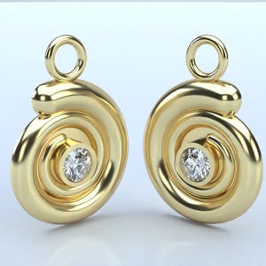 May include: A pair of gold earrings with a spiral design and a small diamond in the centre of each earring.