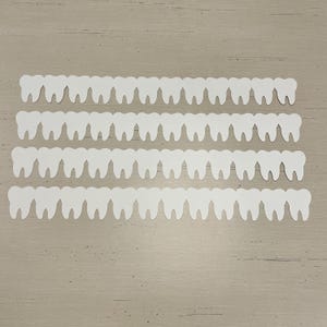 Dentes cortados em papel cartão com borda, conjunto de 4