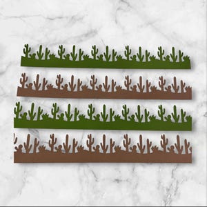 May include: Four decorative paper borders featuring a desert cactus theme. Two borders are green, and two are brown. Each border has a horizontal row of cut-out cacti and desert plants. The borders are ideal for scrapbooking or crafting.