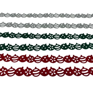 May include: A collection of decorative Christmas ornament borders in various colors. The borders feature cut-out designs of ornaments and star shapes. Colors include gray, dark green, and burgundy. Perfect for holiday crafts and decorations.