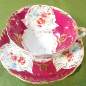 Japan Tea Cup and Saucer , Maroon with gold trim and flowers on cup and saucer( Cs-223 )