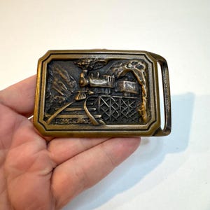Vintage 1970s solid brass "T.E. Express" train belt buckle by Tech Ether Guild.