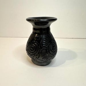 May include: A set of three ceramic mugs with a speckled, matte finish. Each mug features a different color: light blue, cream, and gray. The mugs have a simple, modern design and a comfortable handle.